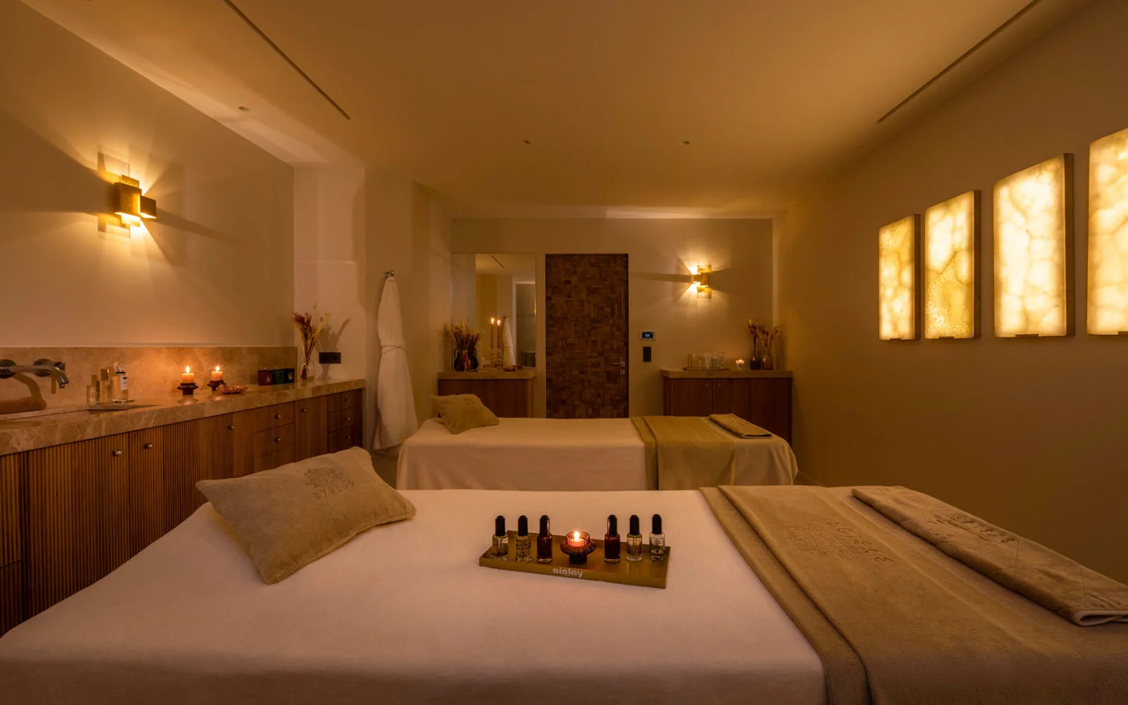 The spa treatment room at Hôtel Byblos, its door clad in Forêt end-grain oak