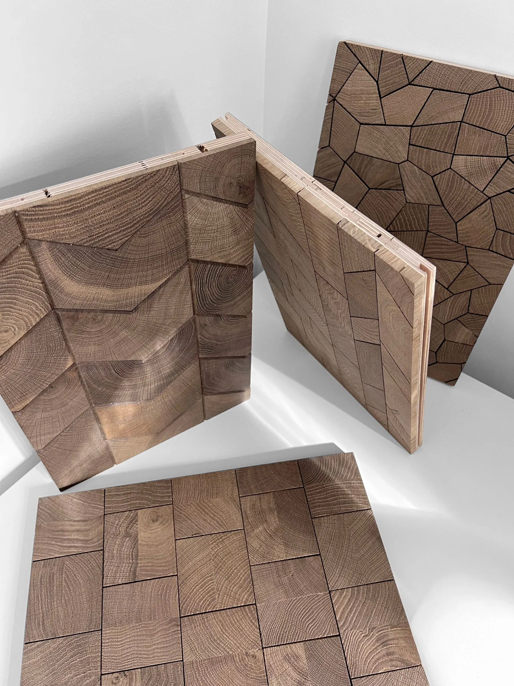 Sample panels stood on the floor, four patterns of endgrain oak