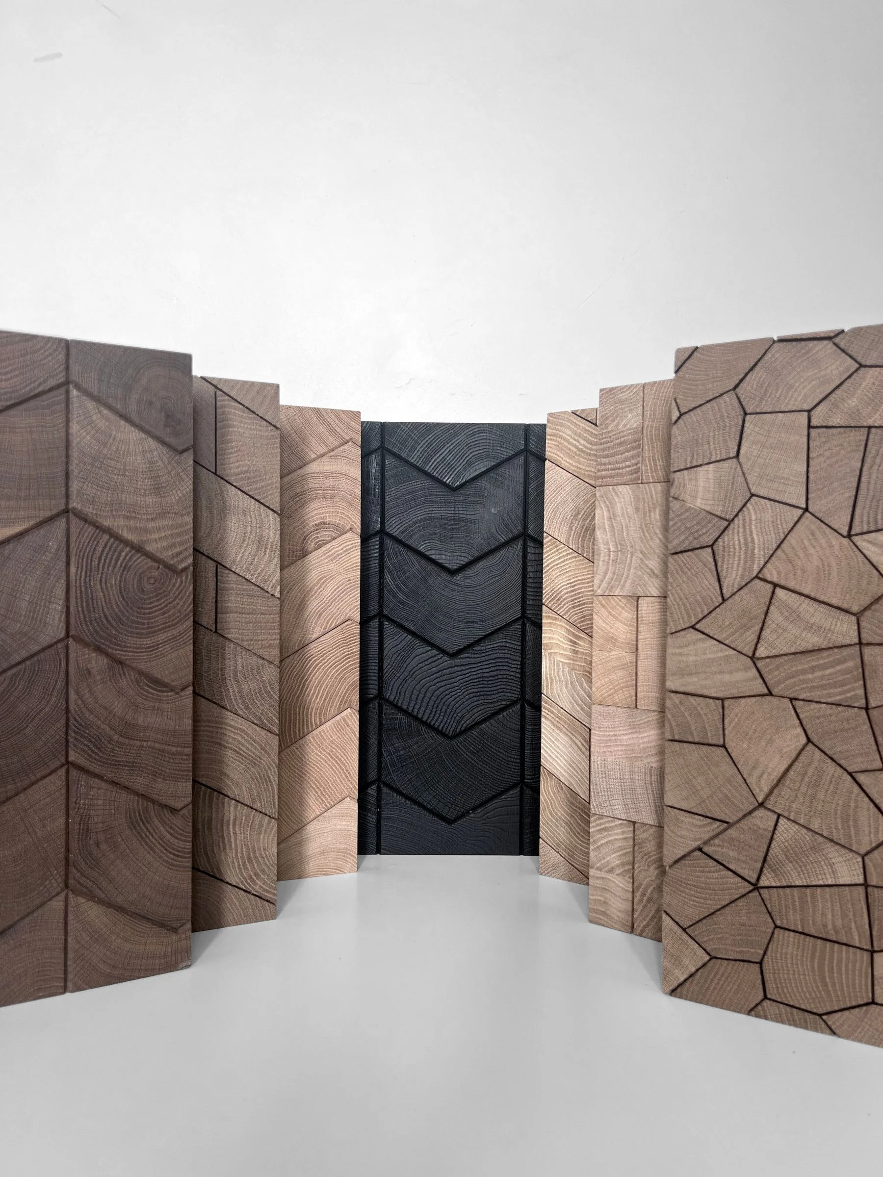 A row of sample panels, one burnt black at the centre